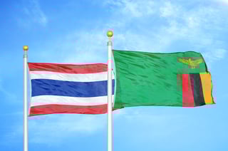 Thailand and Zambian flags waving