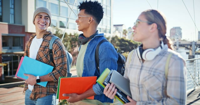 Student Holding Books And Walking At A University