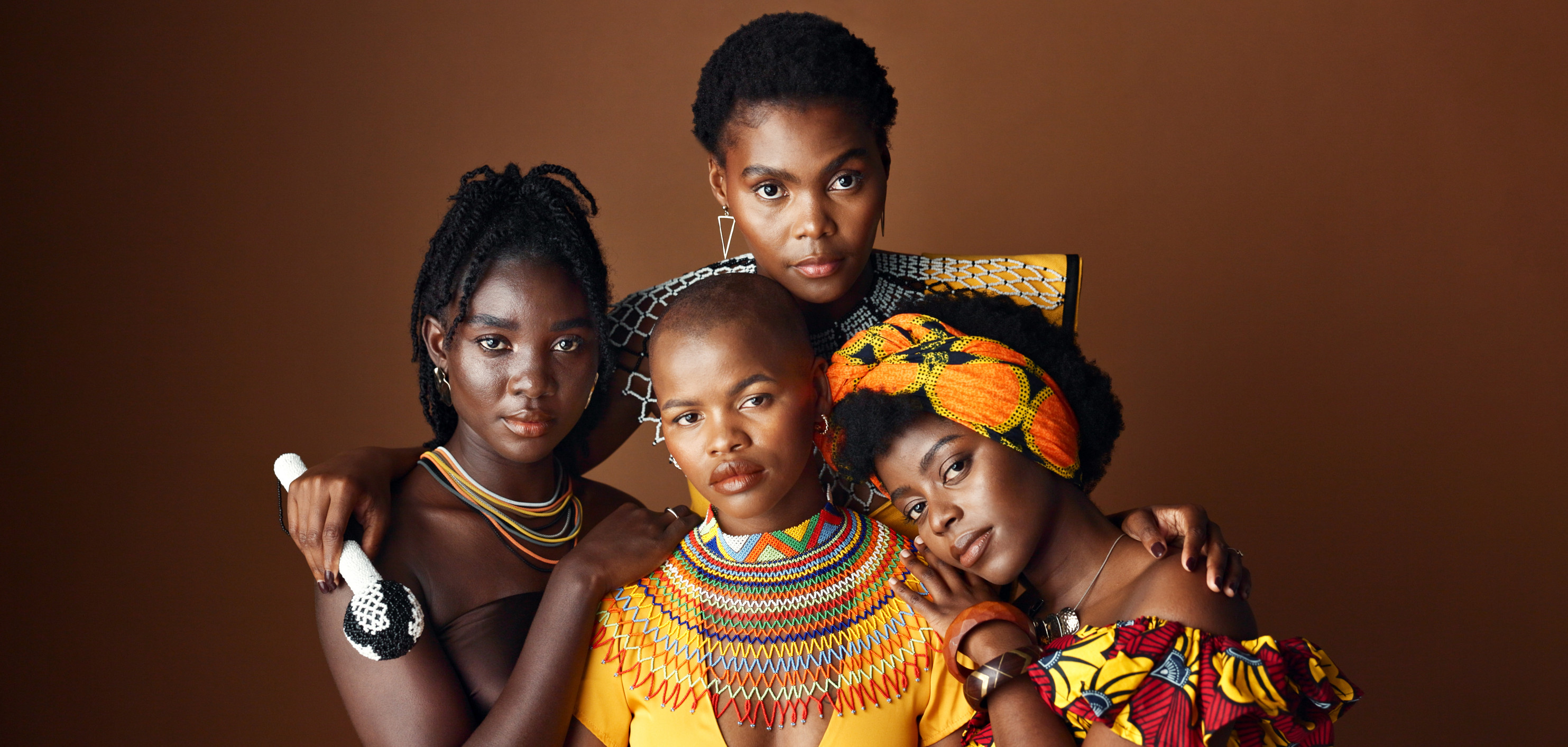 A collective of African girls displaying their traditional attire