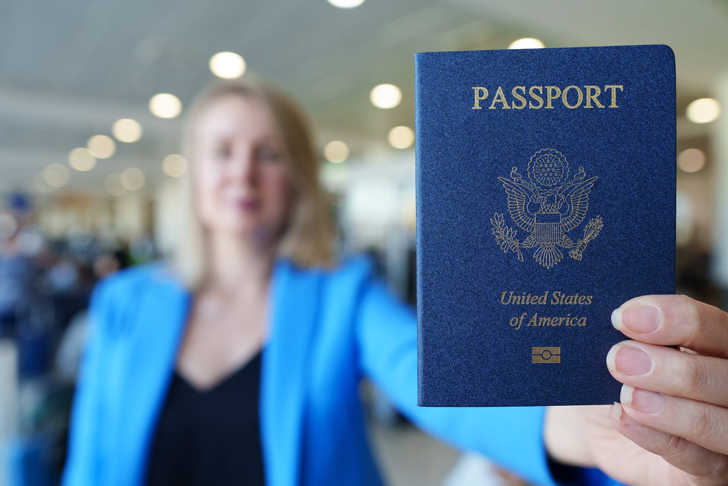 woman showing passport of united states of america