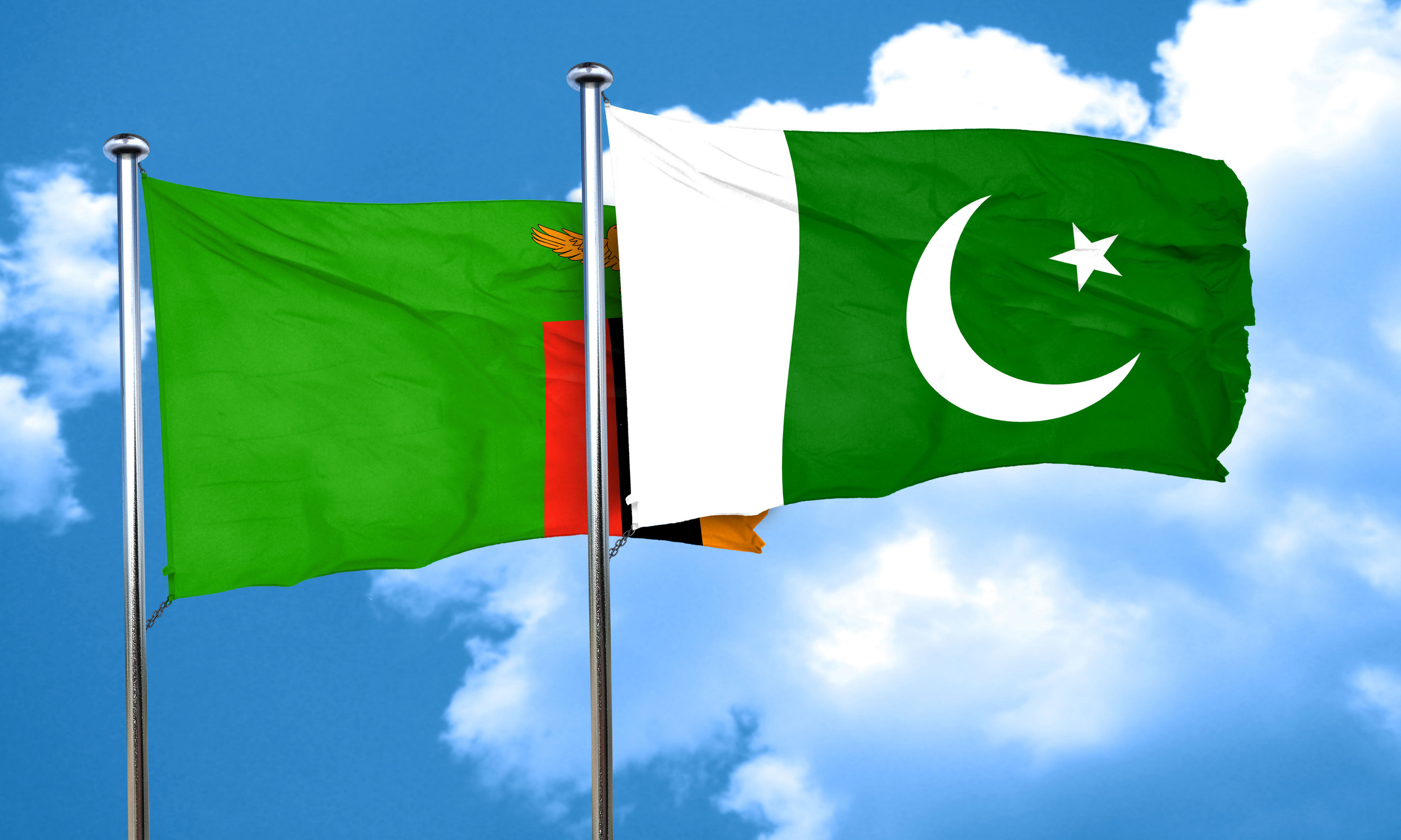 Flags of Zambia and Pakistan waving in the wind